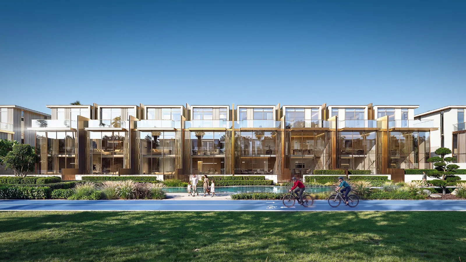 Townhouse residences at Tilal Binghatti with private pool terraces beside a green cycle path