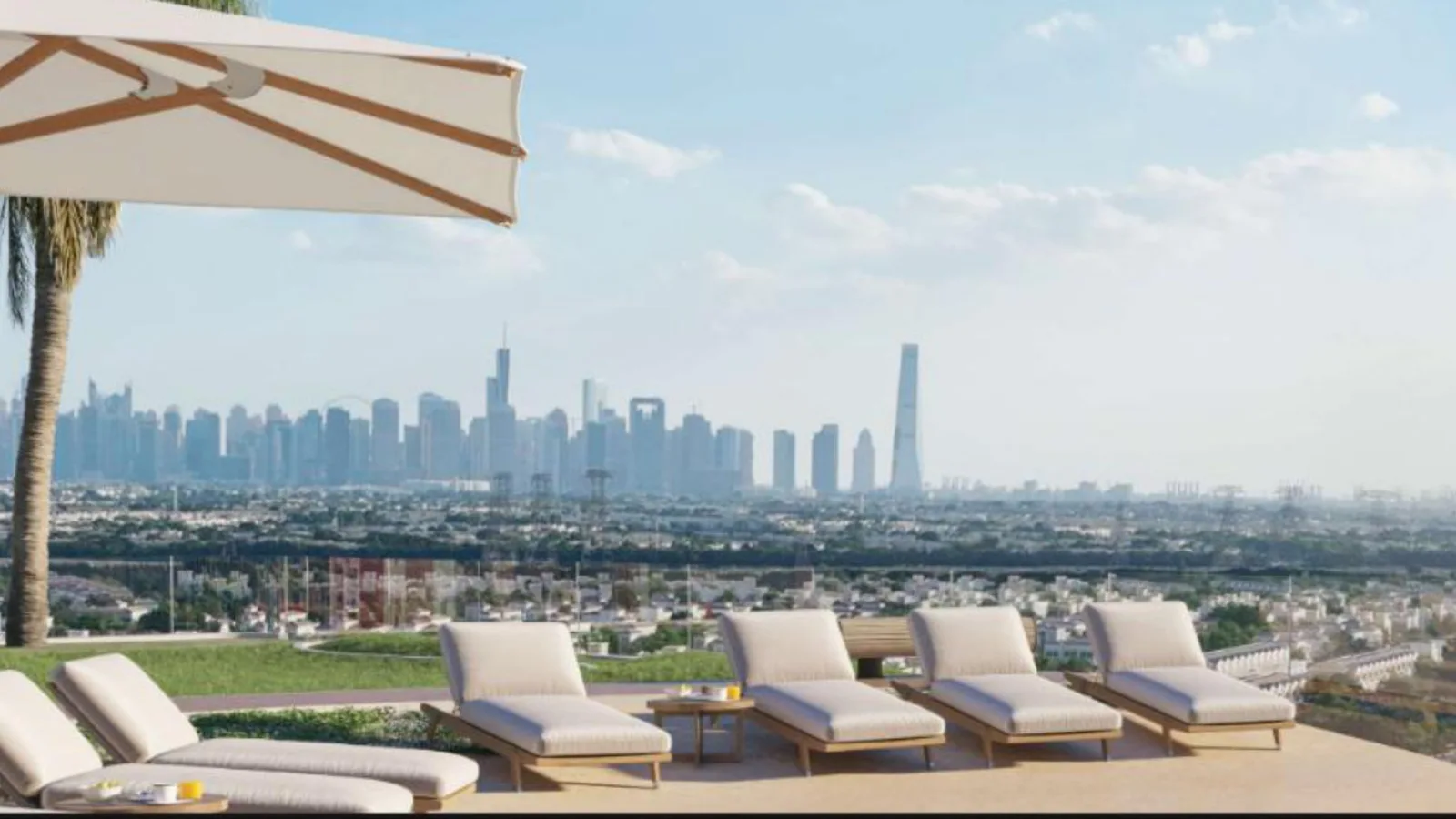 Rooftop pool deck with sun loungers and panoramic Dubai skyline views at VOXA, JVT