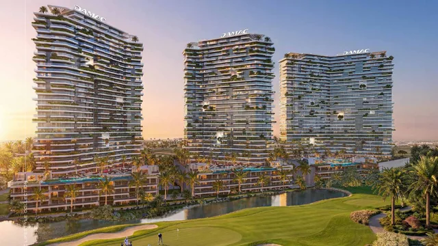 DAMAC Golf Greens towers overlooking the fairways and lagoon at DAMAC Hills, part of The Lifestyle Collection