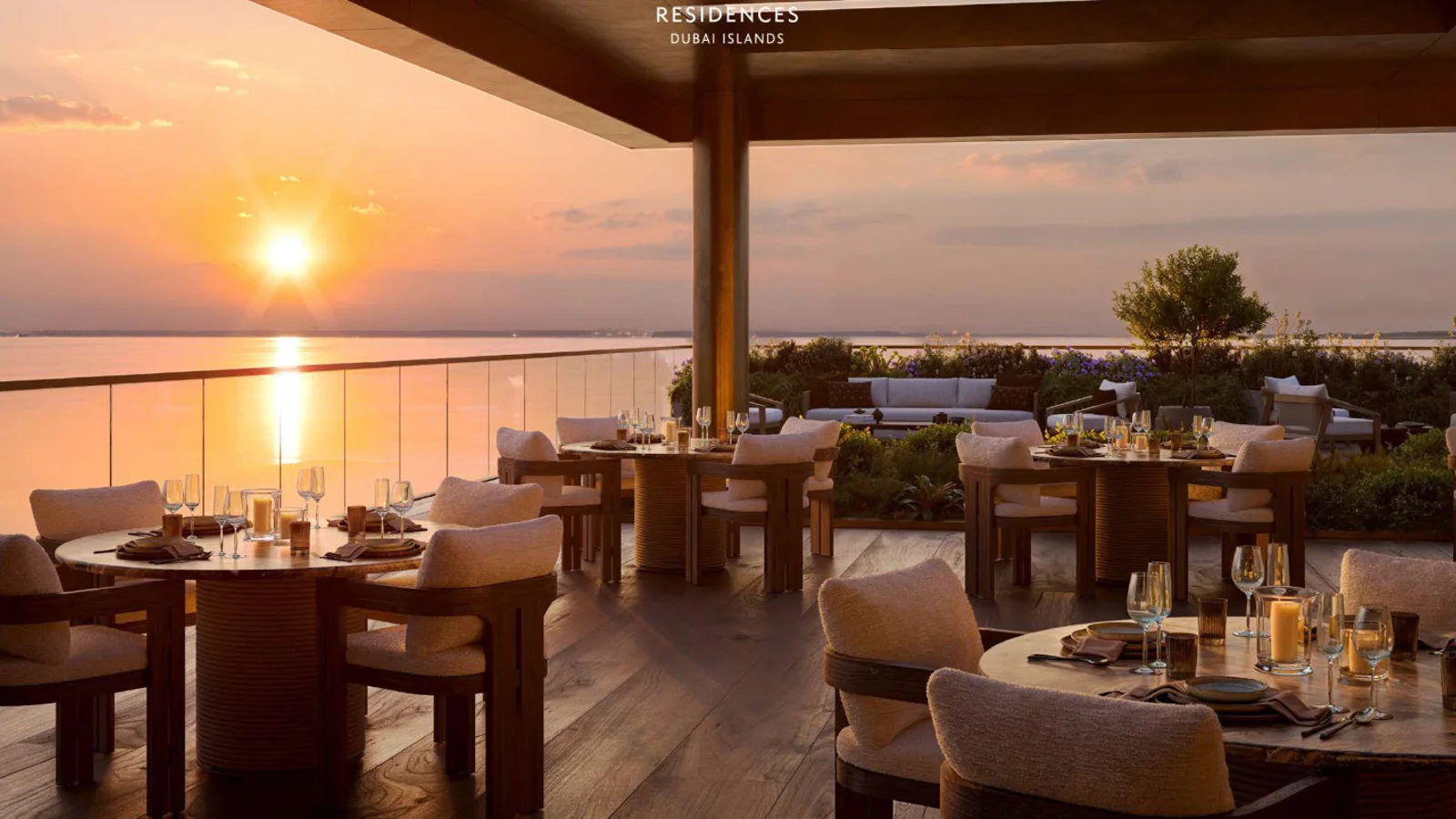 Cheval Residences restaurant with a sea-view terrace at sunset