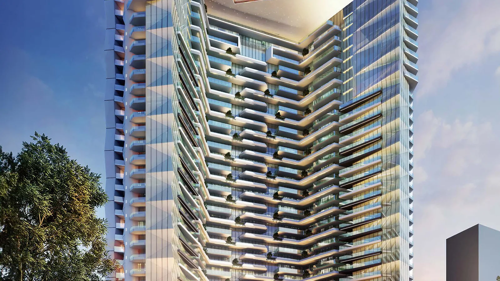 Street-level view of the Élevé tower by Deyaar with its terraced glass façade