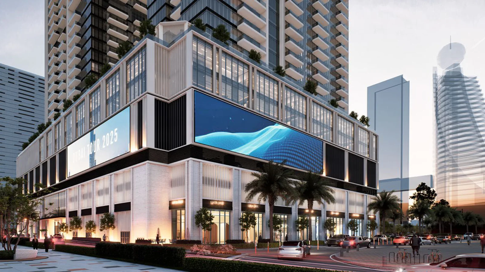 Street-level view of the illuminated retail and F&B podium beneath Avenue Park Towers at wasl1, Dubai