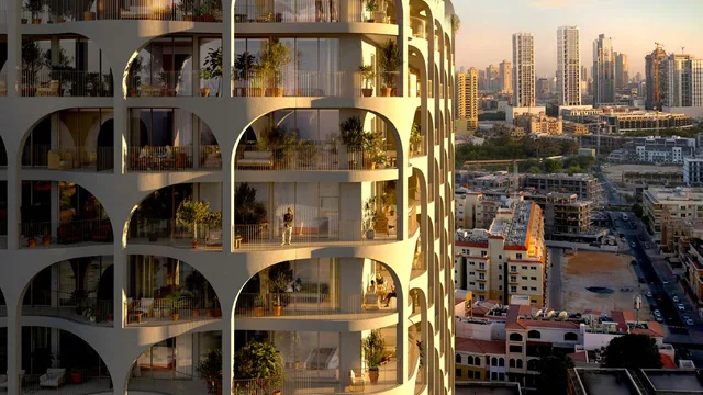Aerial view of The Weave and the surrounding Jumeirah Village Circle skyline.
