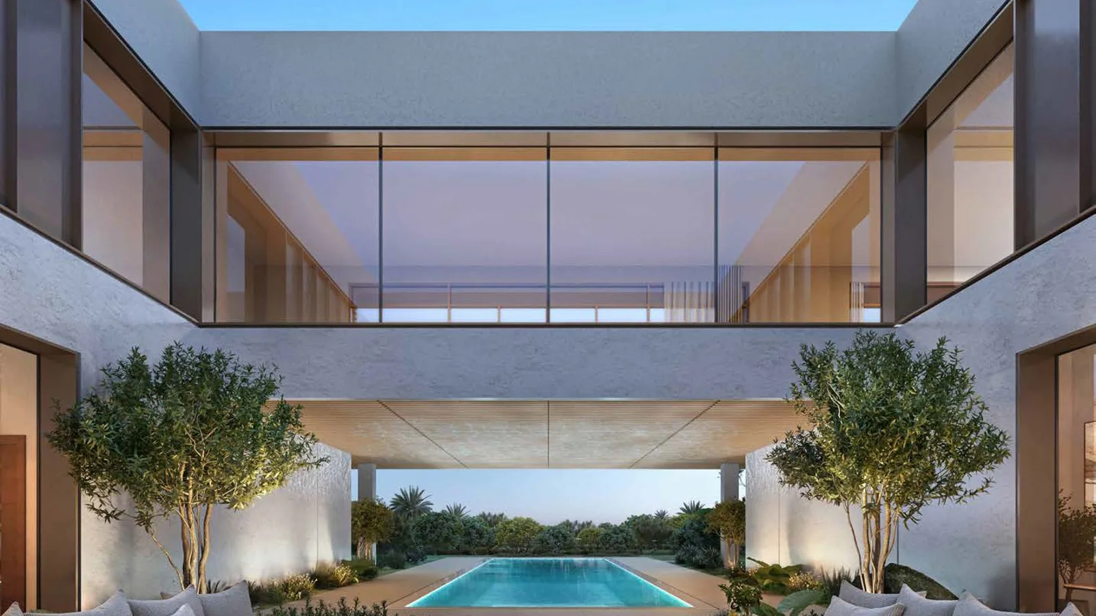 Y Views at Bayn villa courtyard framed by glazed rooms and a long garden pool