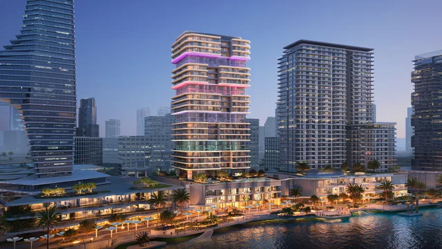 The Artery Residences tower illuminated above the Makers District waterfront on Al Reem Island