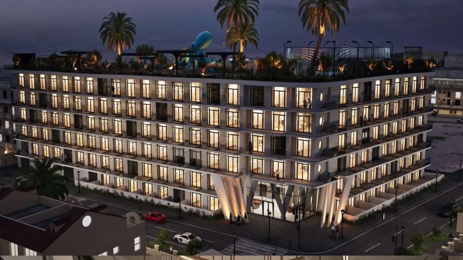 Illuminated night exterior of Avana Residences in Jumeirah Village Circle