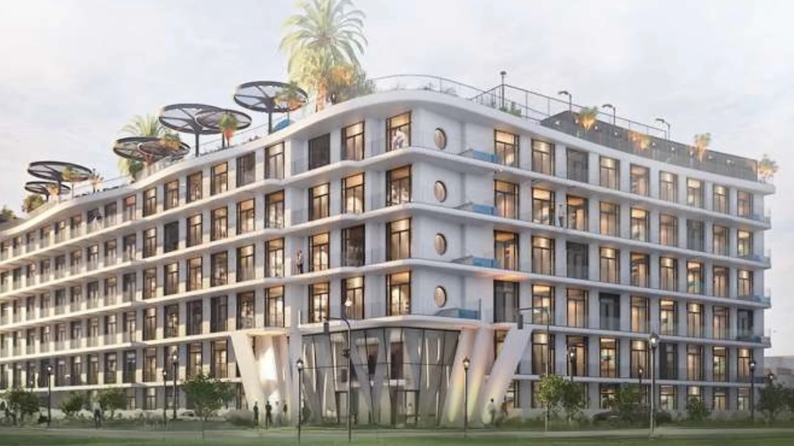 Daytime front facade and landscaped approach at Avana Residences