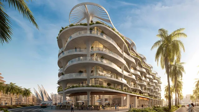 Wide street view of Mamsha Palm's curved, palm-inspired facade