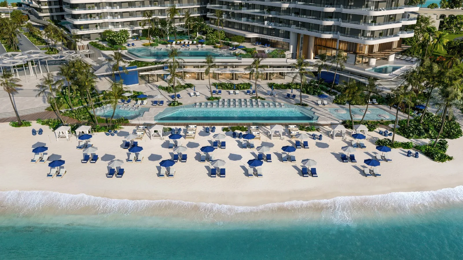 Beachfront swimming pools and landscaped deck at Nikki Beach Residences