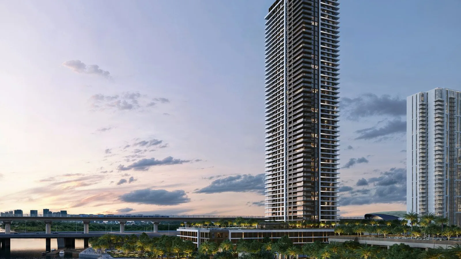 Palace Residences Creek Blue exterior and landscaped podium at dusk.