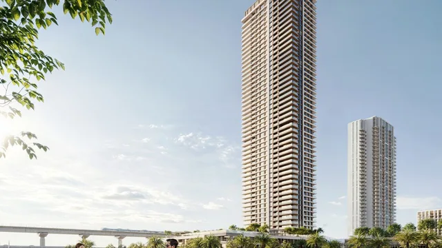 Palace Residences Creek Blue tower beside the waterfront promenade.