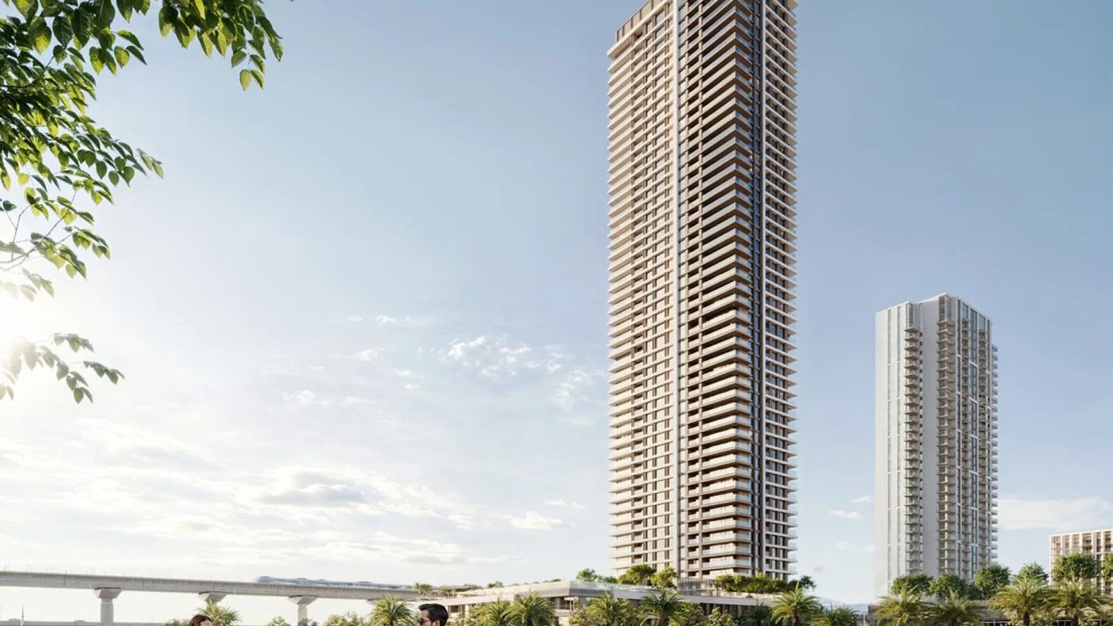 Palace Residences Creek Blue tower beside the waterfront promenade.
