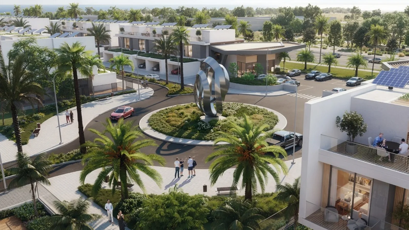 Landscaped community entrance and townhouses at Aila Homes