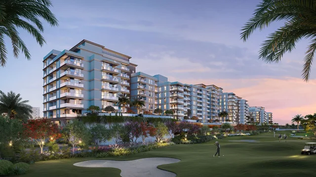 Golf-facing residential buildings at Al Hamra Greens at sunset