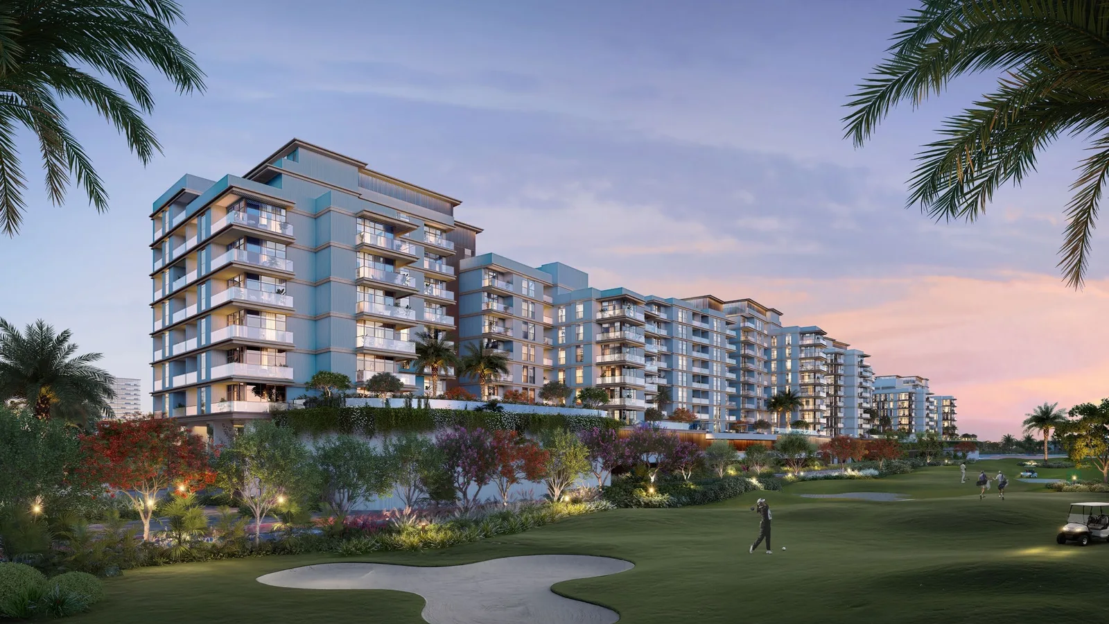 Golf-facing residential buildings at Al Hamra Greens at sunset