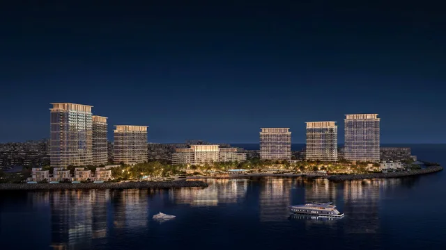 Address Residences Al Marjan Island illuminated waterfront skyline at night