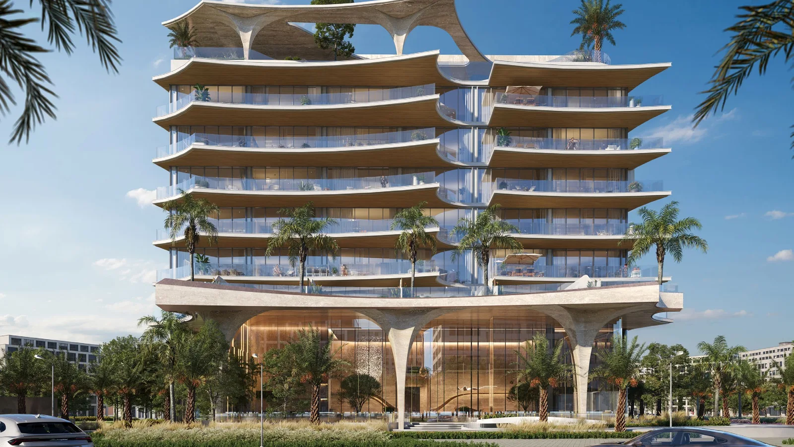 Front exterior of Ola Residences with curved balconies and landscaped arrival area