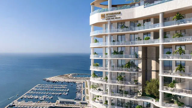 Seafront exterior of Wyndham Residences Al Marjan Island with marina views