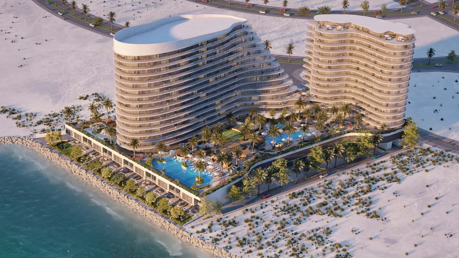 Aerial view of The Beach Residences, its pool deck and beachfront setting