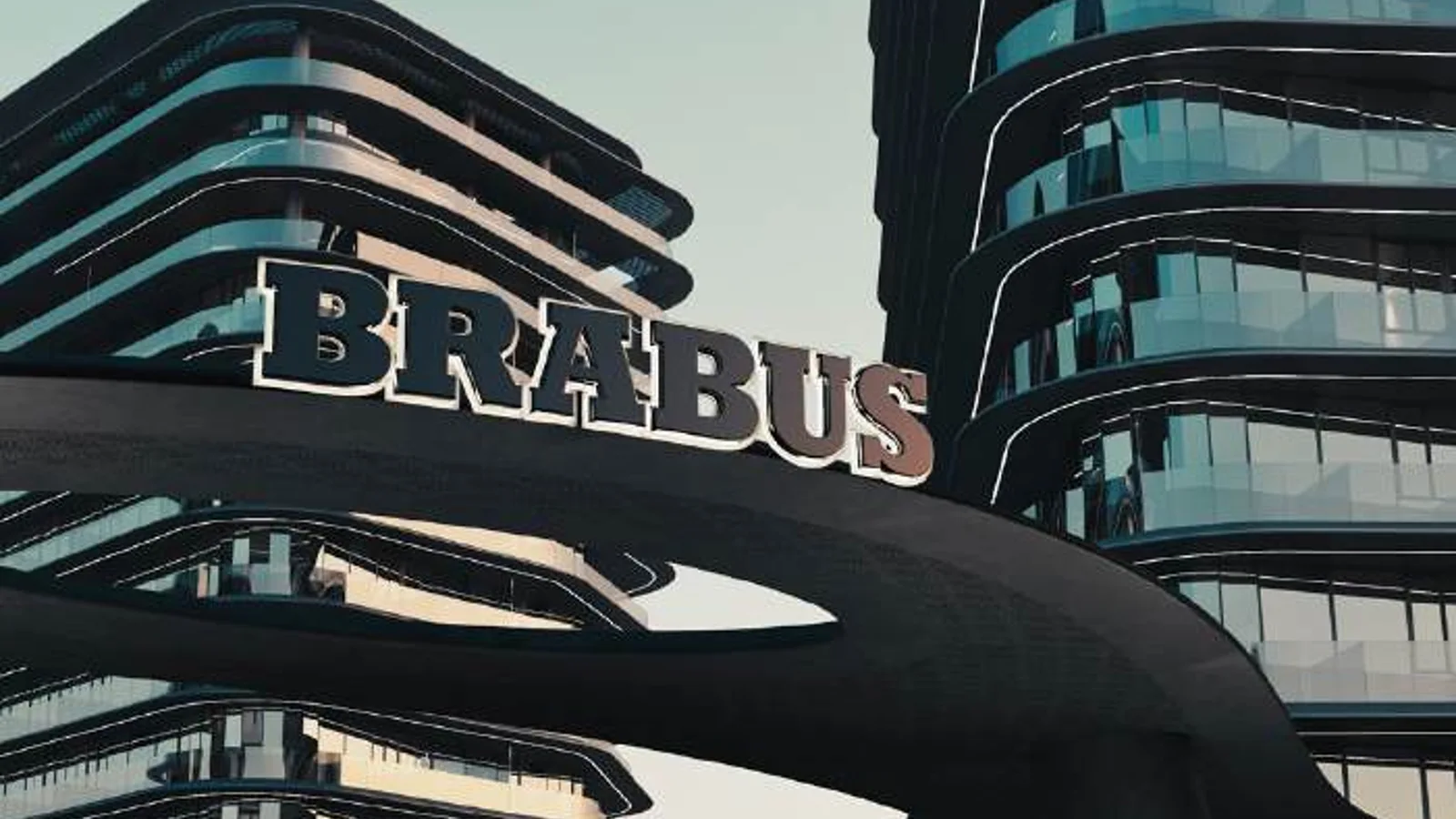 BRABUS-branded entrance framed by the residential towers