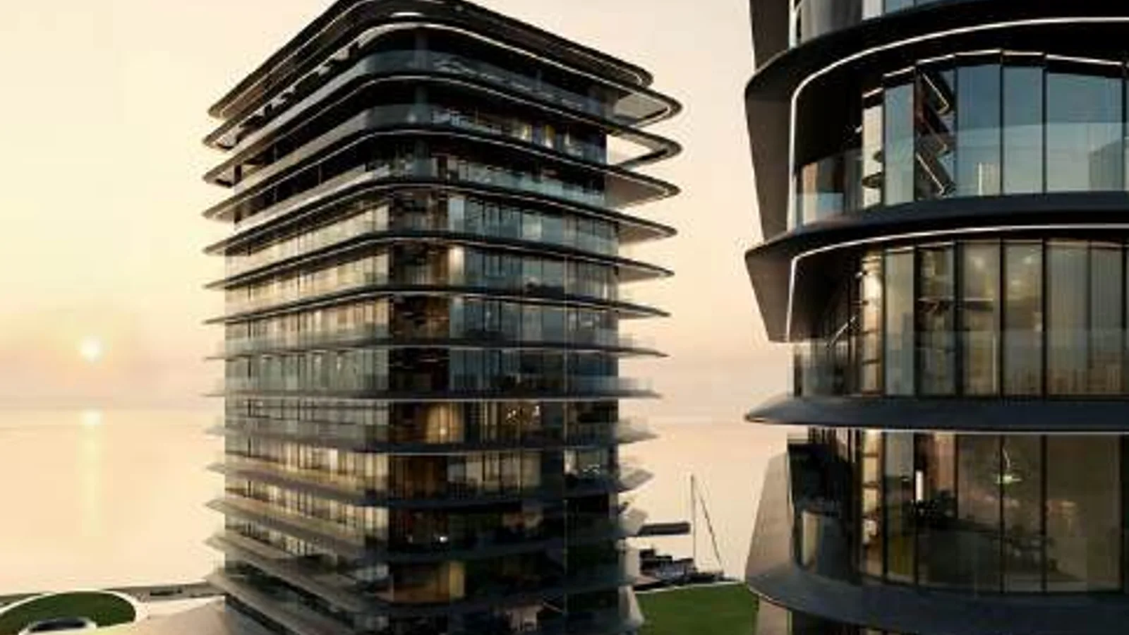 Curved glass tower facades at Brabus Island beside the waterfront