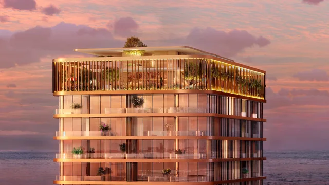 Sunset exterior of Isla Private Residences overlooking the sea
