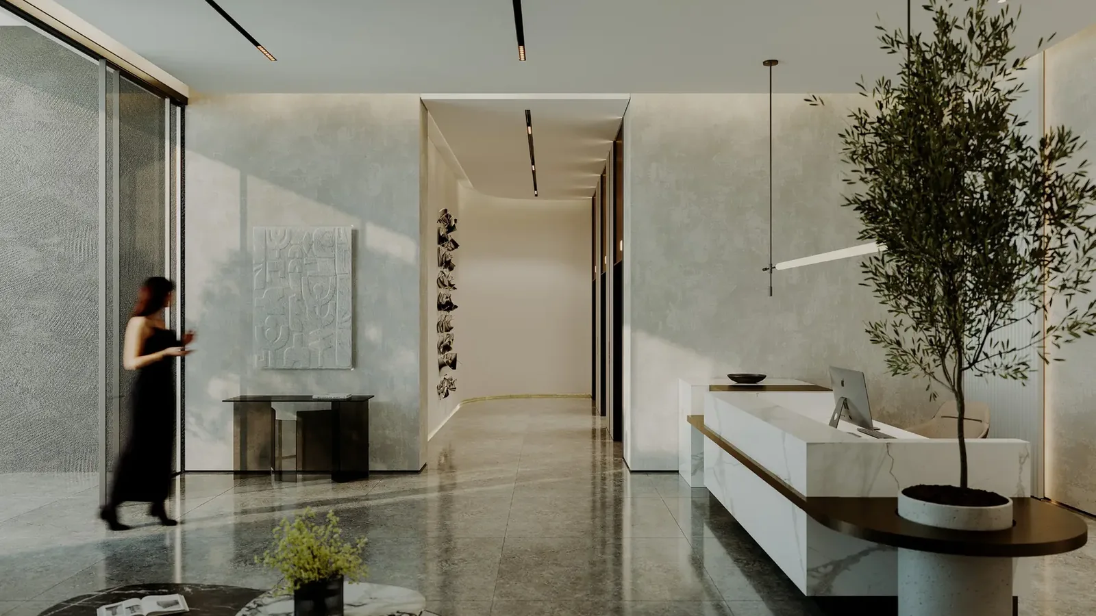 Norah Residence arrival lobby with stone finishes and a reception desk