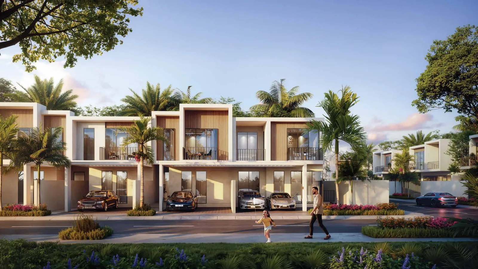 Town villas on a landscaped street at Sukoon by Sanzen