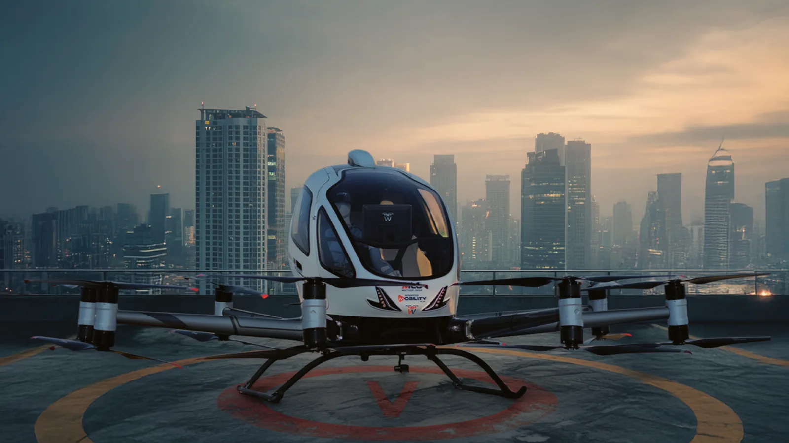 One Residence rooftop vertiport with an electric air taxi above Al Reem Island