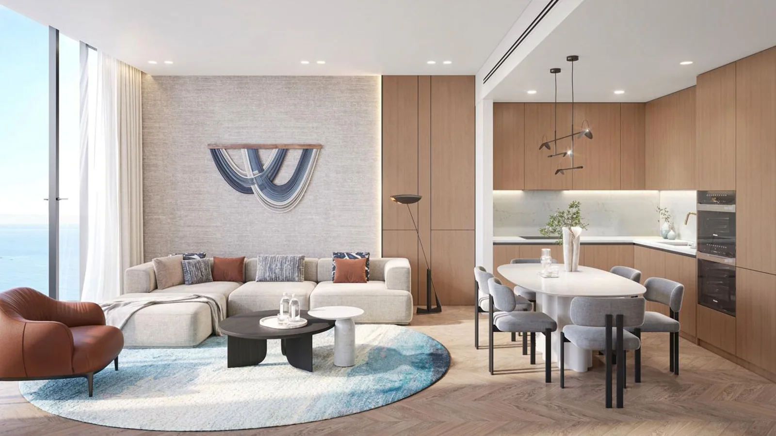 Living and dining room at The Residences at Sheraton Al Marjan Island Resort with full-height sea-view glazing