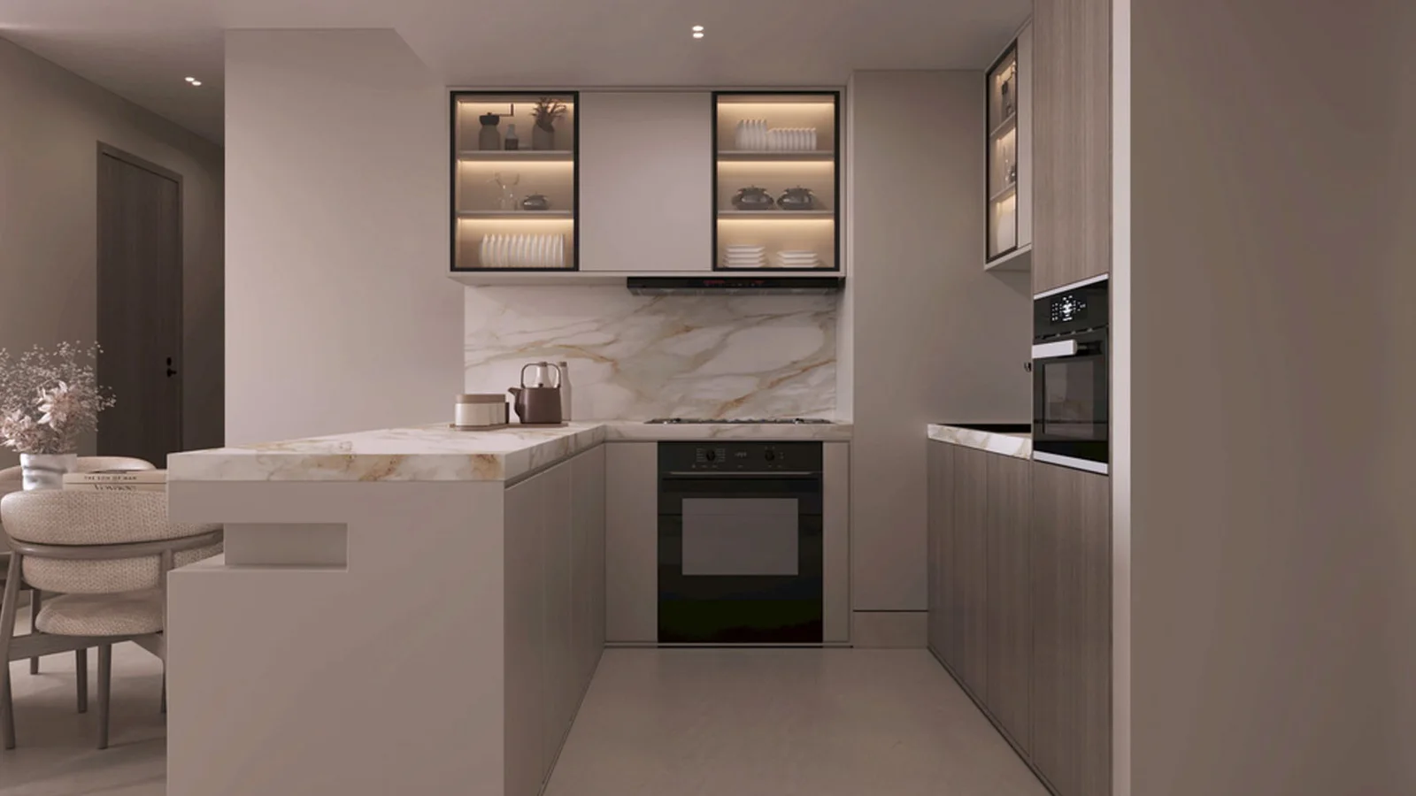 Arib Collection apartment kitchen with marble-effect surfaces, integrated appliances and illuminated cabinets.