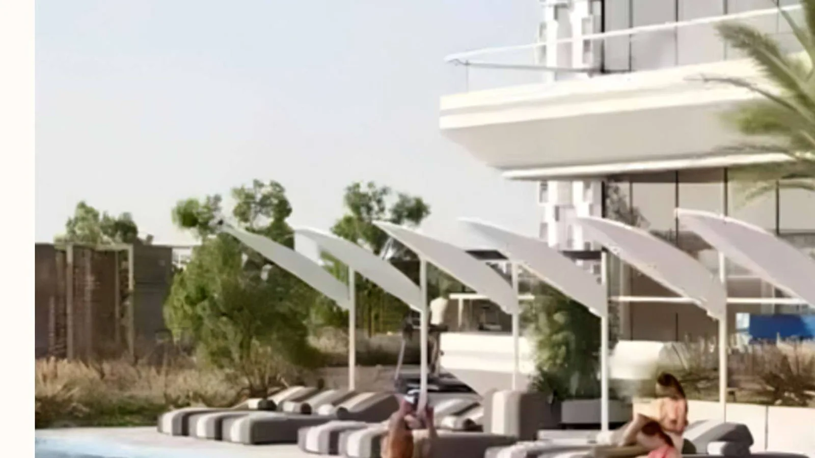 Crystal Tower swimming pool with poolside loungers and shaded seating.