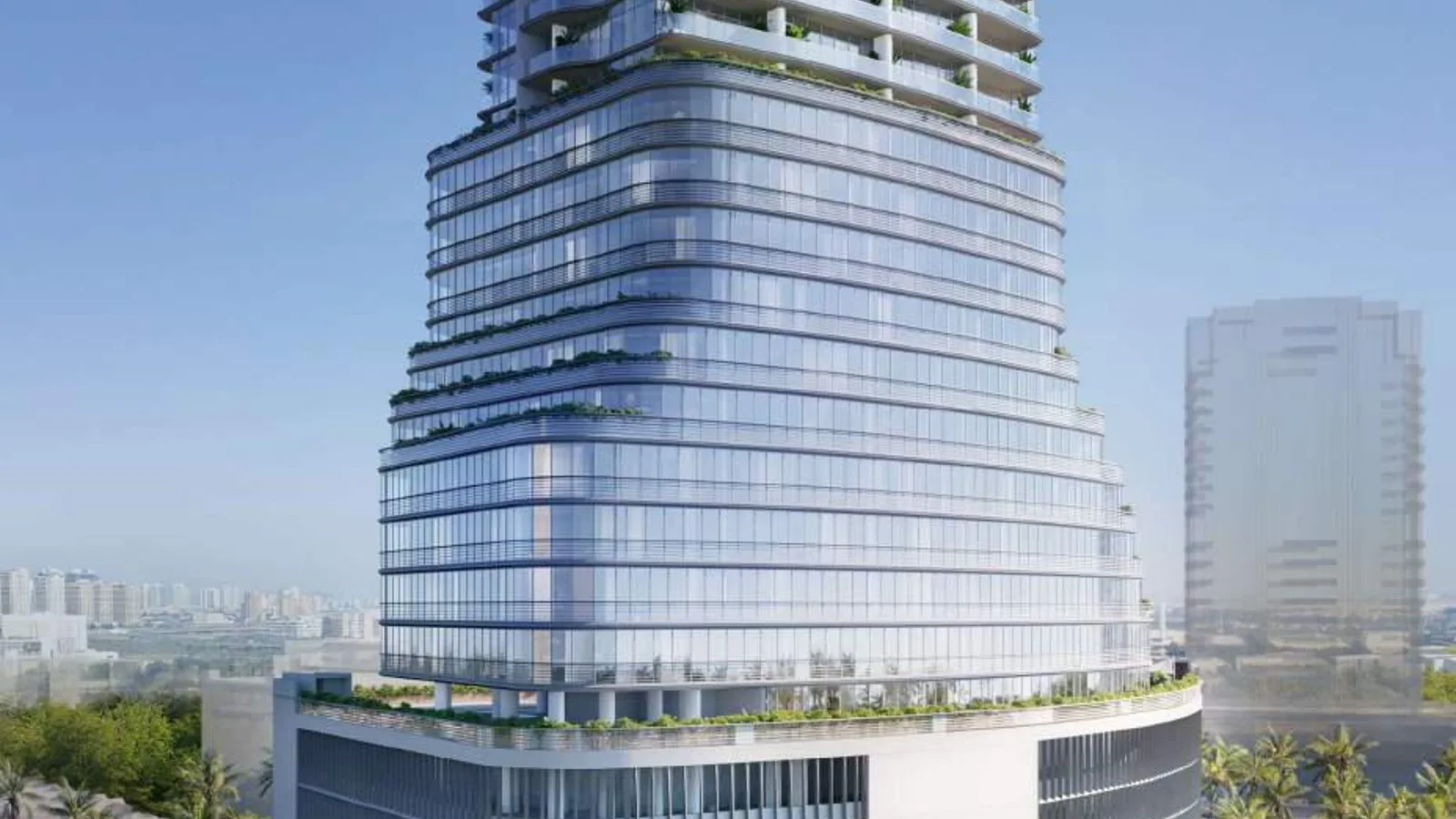 Daytime view of ELAR1S Axis showing its curved office facade, residential balconies and retail podium.