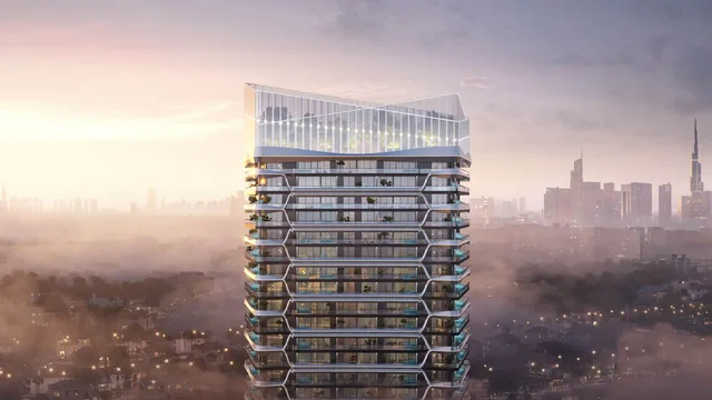 Hadley Heights 2 tower exterior rising above Dubai Sports City at sunset.
