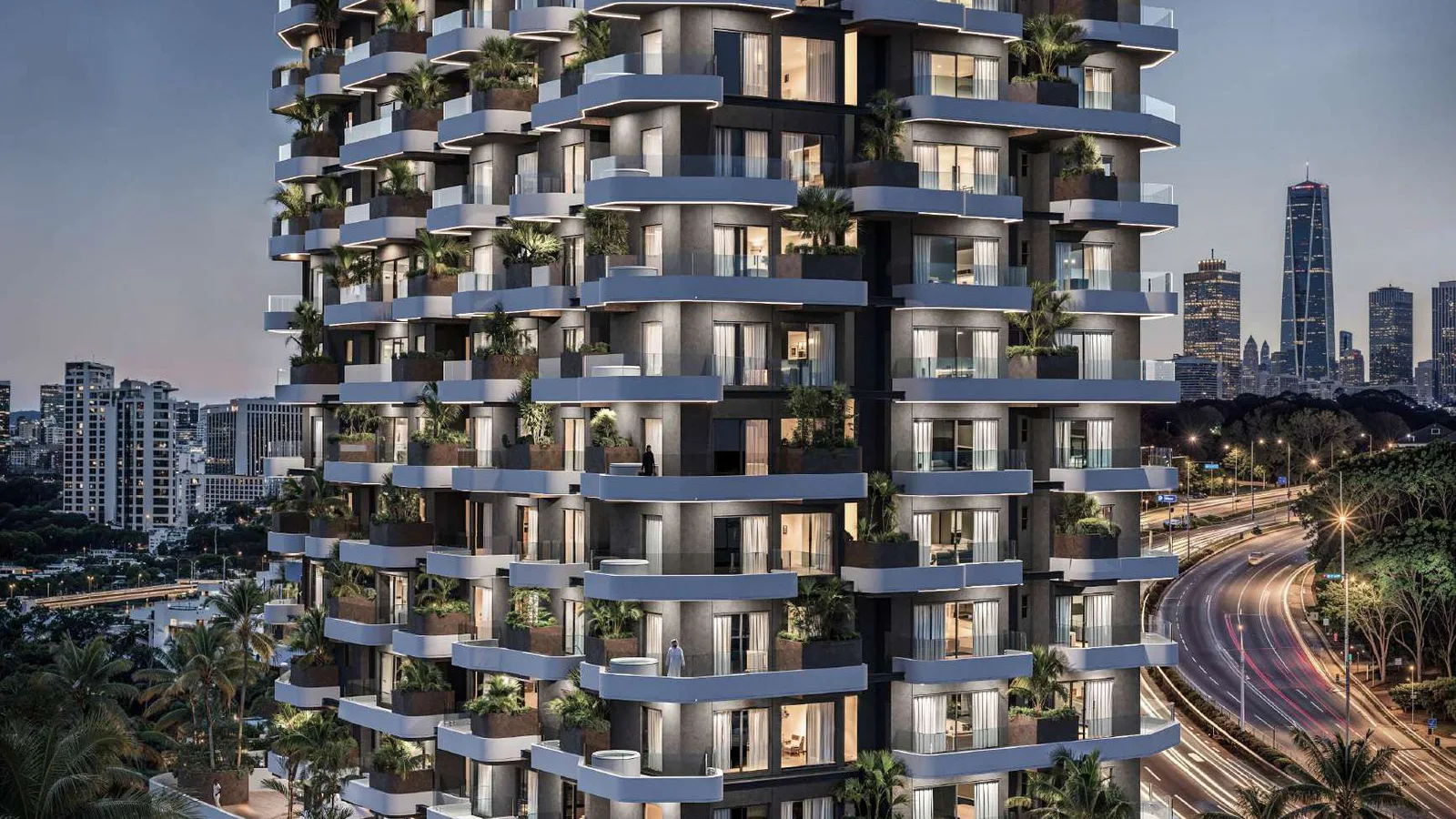 Marea Residence exterior at twilight with illuminated balconies
