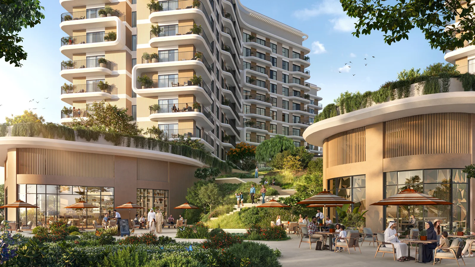 Retail and dining promenade framed by landscaped terraces at Yas Park Place