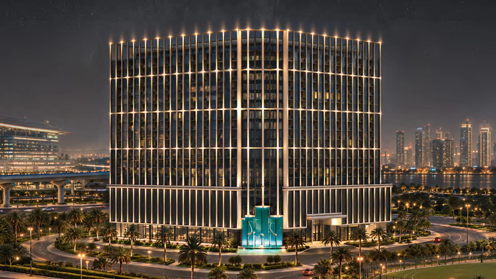 Night-time exterior view of Binghatti Starfall and its illuminated podium.