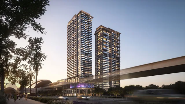 Twin towers at dusk beside the metro infrastructure at Avenue Park Towers II.