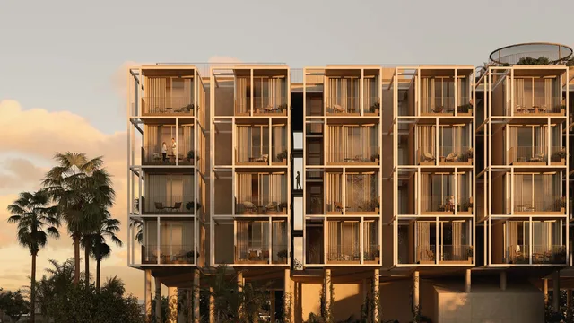 Low-rise façade with recessed balconies at sunset at Tessera by Al Ghurair.