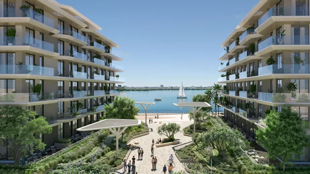 Landscaped pedestrian approach between the waterfront residence buildings at Bashayer Residences.