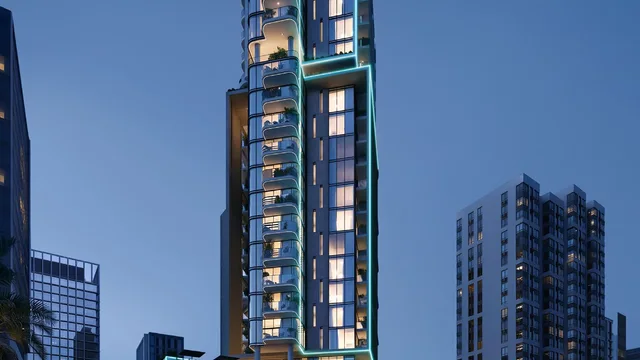 Illuminated tower with curved balconies above the podium at Samana Downtown One.