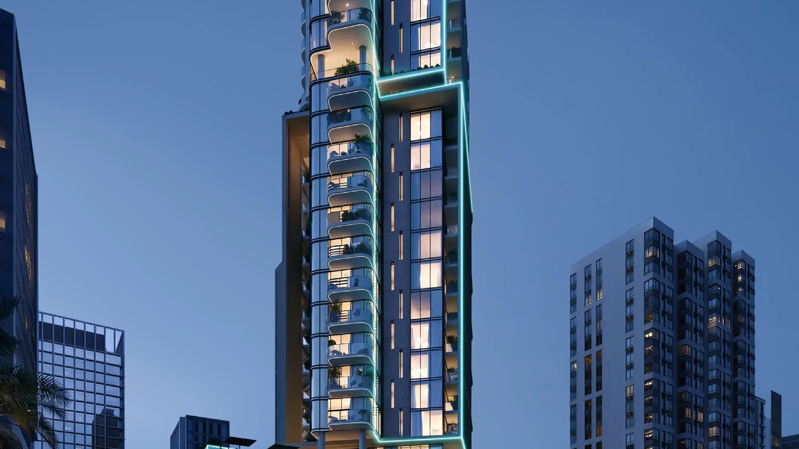 Illuminated tower with curved balconies above the podium at Samana Downtown One.