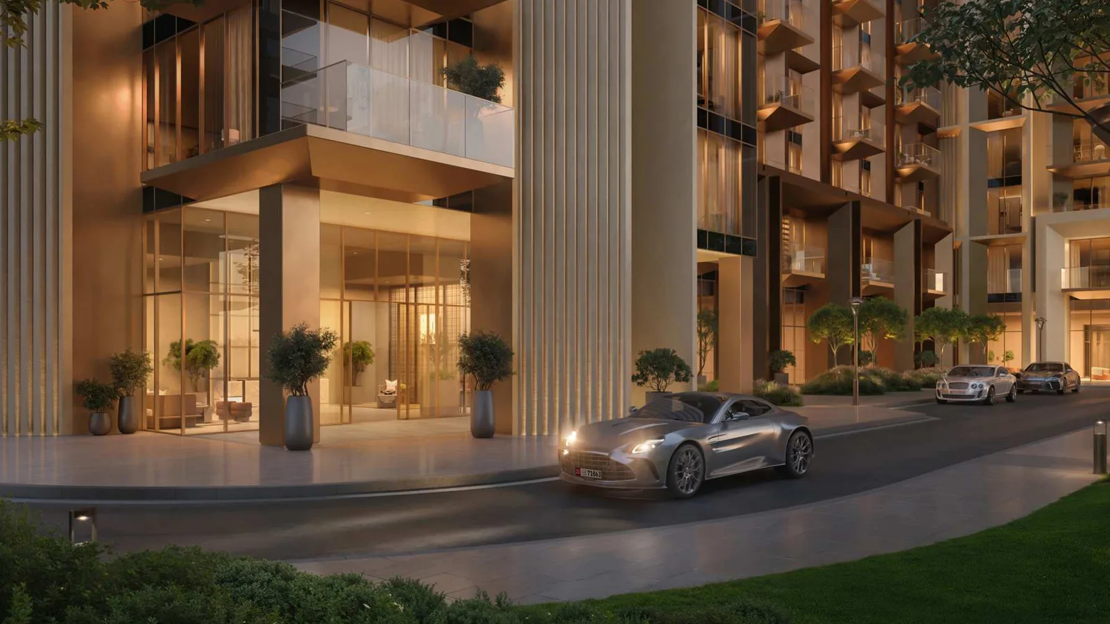 Sei Saadiyat residential entrance with glazed lobby and planted arrival frontage