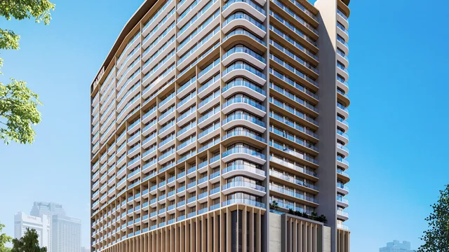 Azizi Arian tower with curved balconies and landscaped arrival in daylight
