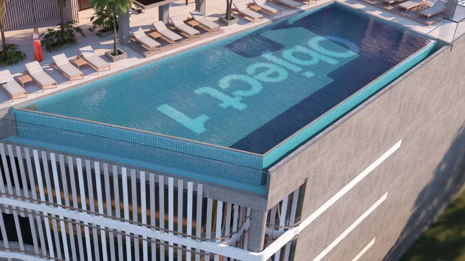 TETR1S Tower podium swimming pool with sun loungers and landscaped seating areas.