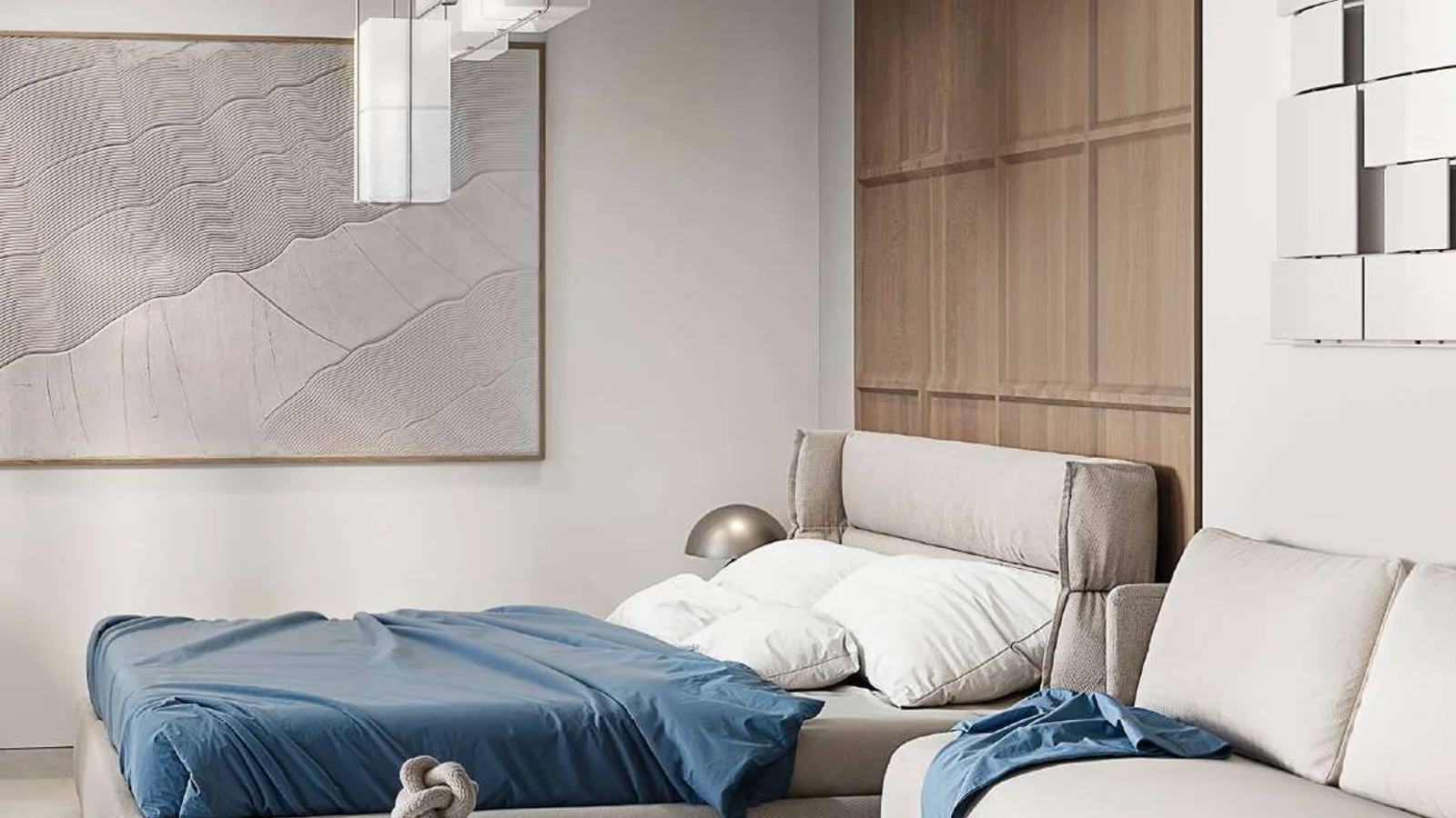 TETR1S Tower studio interior with a sleeping area, lounge seating and neutral finishes.