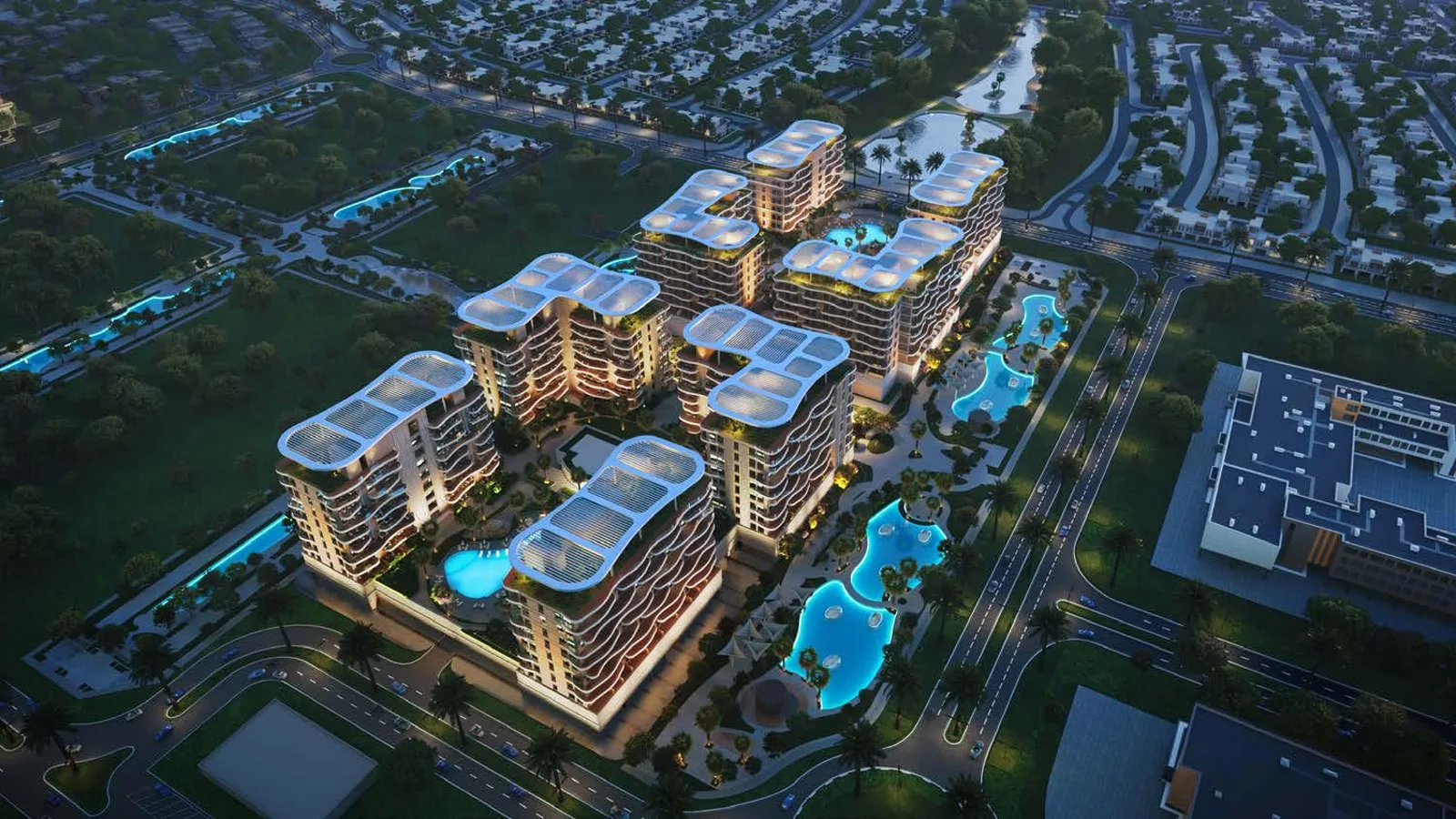 Aerial exterior view of DAMAC Sorrento beside the community lagoon and landscaped public spaces.