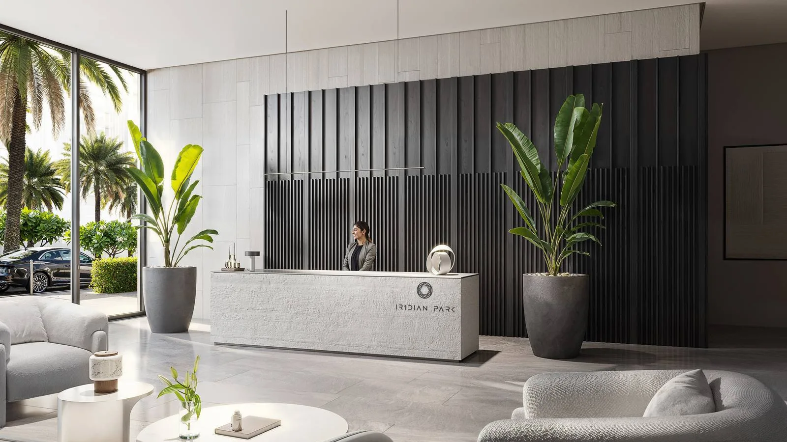 IR1DIAN Park 1 lobby with a contemporary reception desk, lounge seating and full-height glazing.