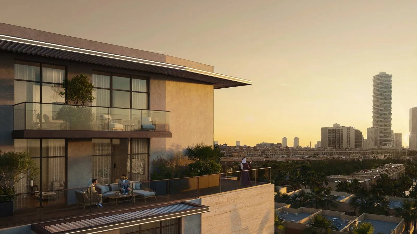 Rooftop terrace view from IR1DIAN Park 1 across Jumeirah Village Circle at sunset.