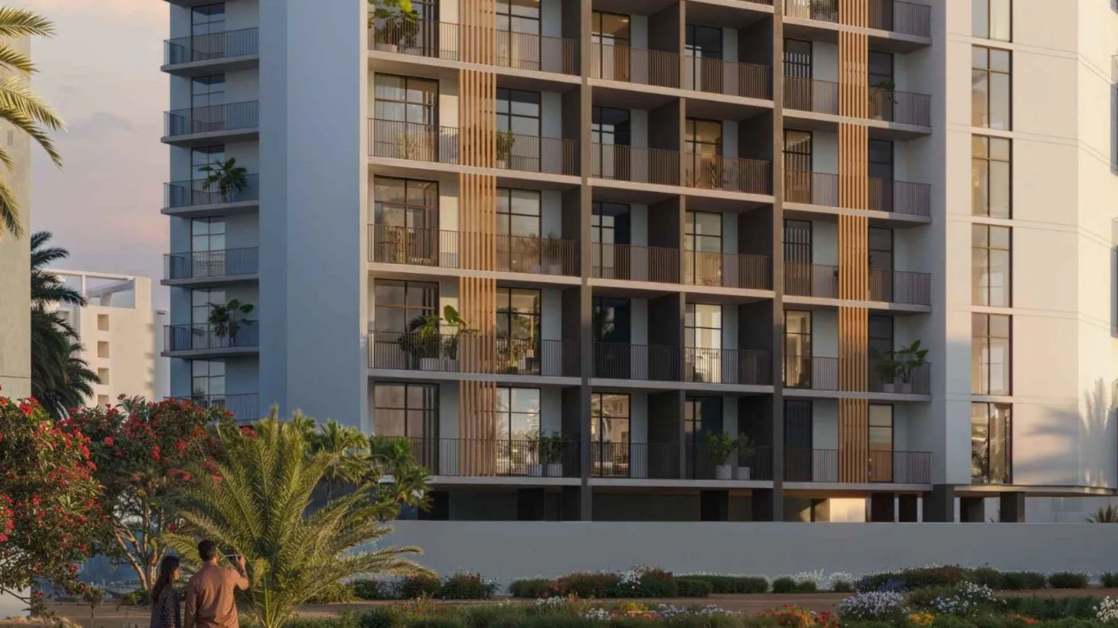 Landscaped frontage at VERDAN1A 2 with the residential facade and palm-lined public realm.